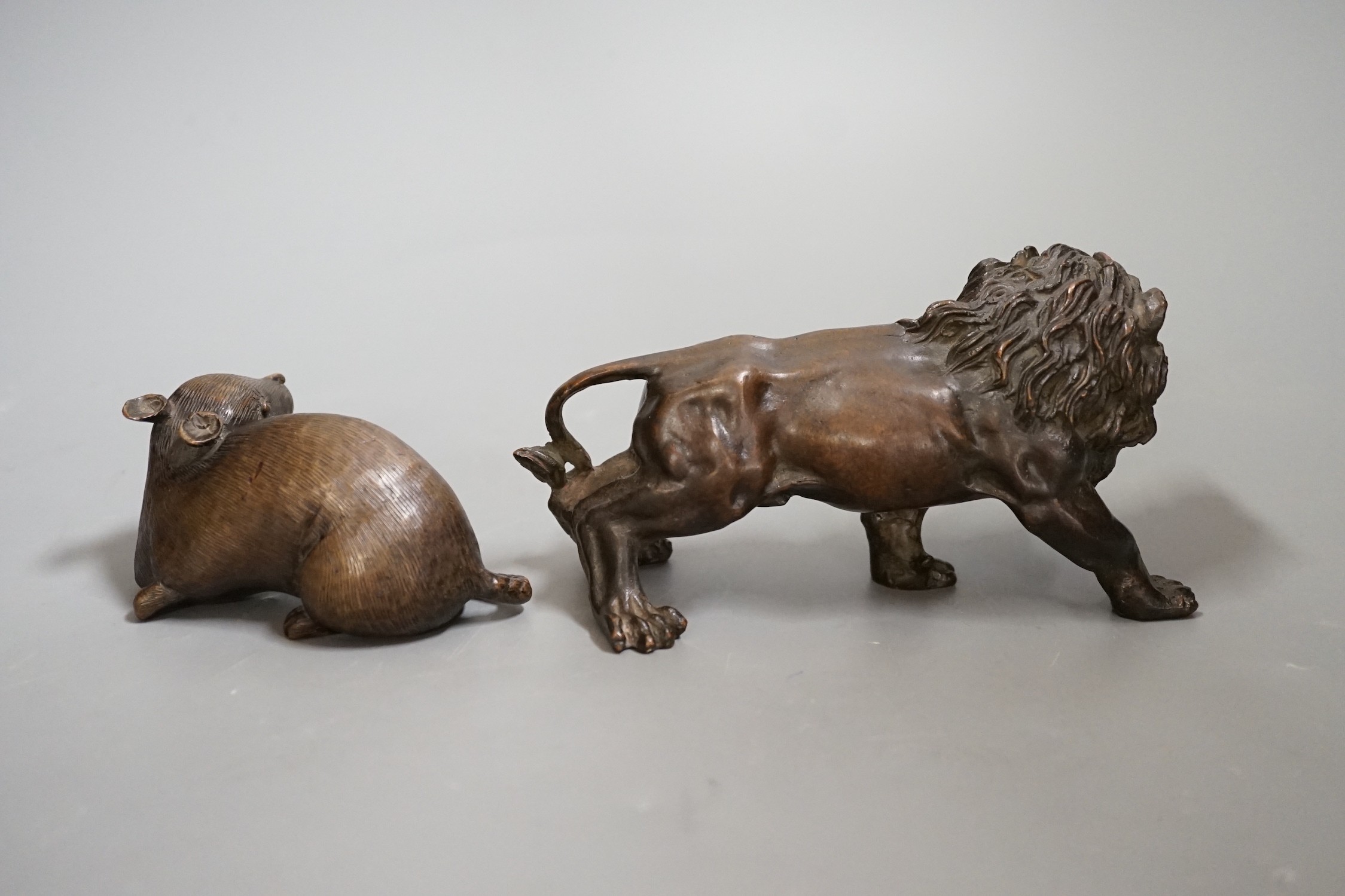 A bronze figure of a rat and another of a lion, 16cm wide